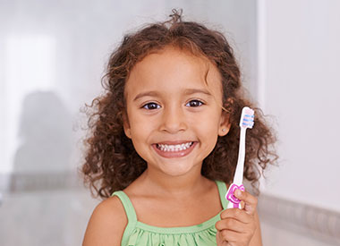 Little Girl smiling in dental chair