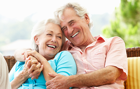 White elderly couple laughing together